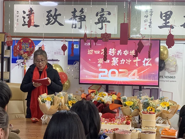 A person is speaking at the annual meeting