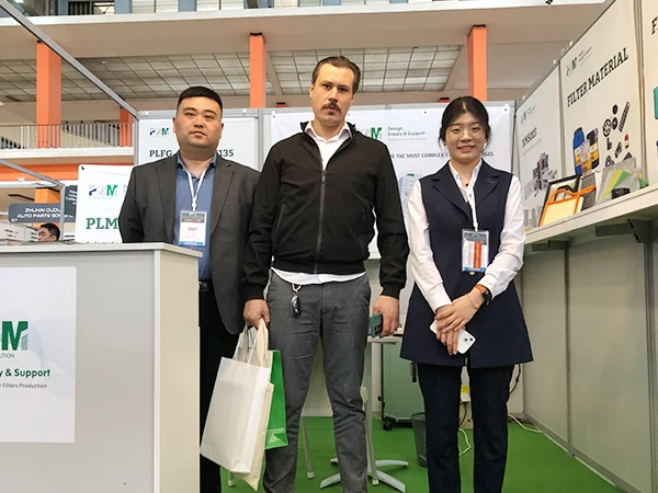 Two gentlemen and a lady in a group photo