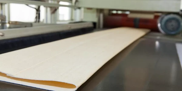 Automated sewing of dust collector filter bags
