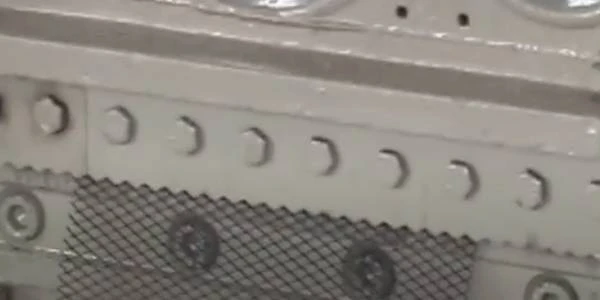 Expanded metal mesh manufacturing machine is producing inner and outer mesh.