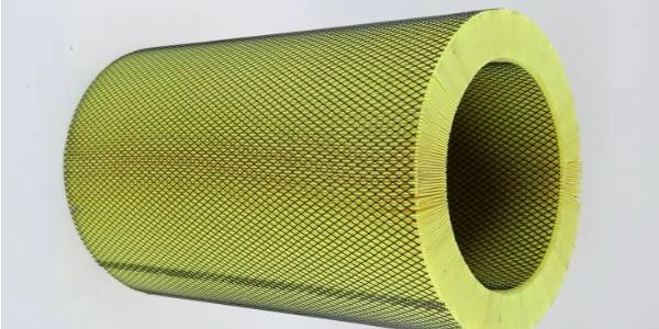 A dust collector filter cartridge on a gray background