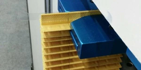 The bonding machine is bonding the cut and pleated filter paper.