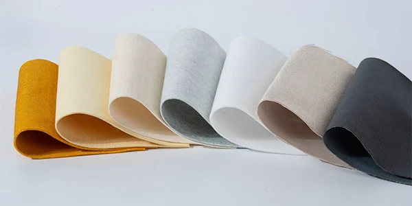 Various types of filter fabrics on a gray background