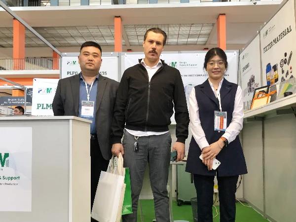 A photo of two staff members with a customer