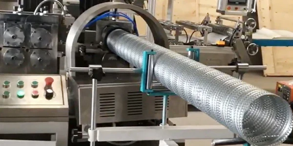 The machine is producing spiral perforated metal for central support.