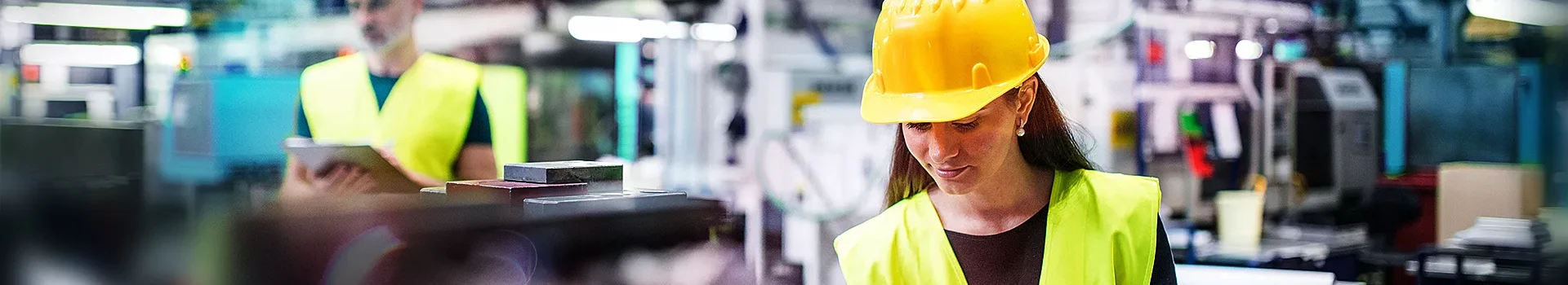 A technical worker is working at the factory.