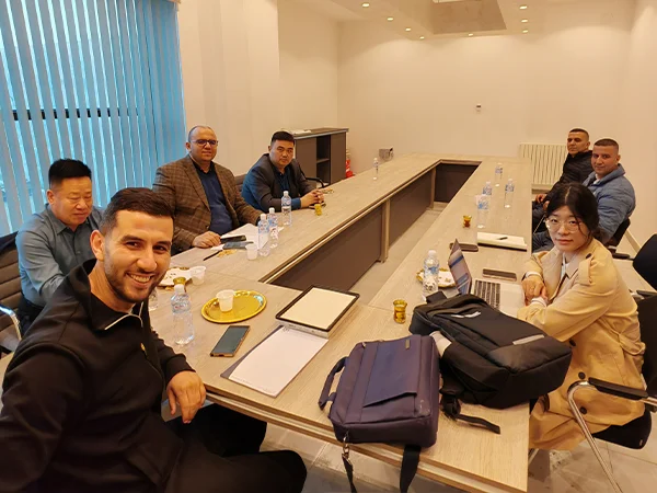 People are taking a photo in the meeting room.