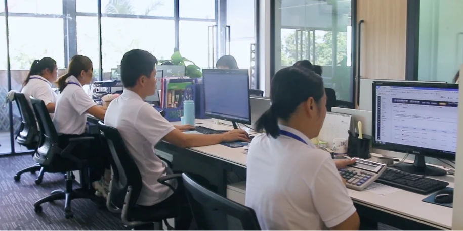 Our office workers are handing their work in the office.
