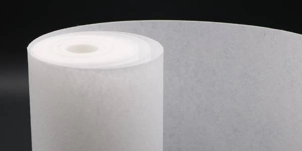 A roll of white non-woven fabric