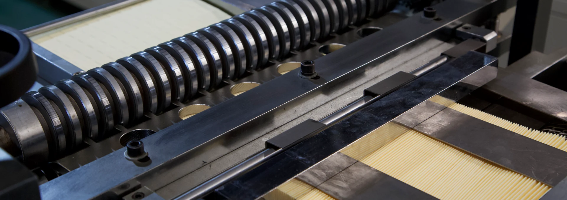 The pleating machine is operating.