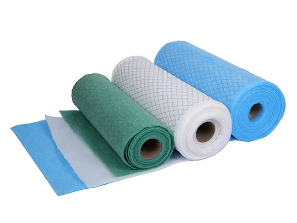 Three colorful rolls of primary-efficiency filter media with a metal mesh support layer