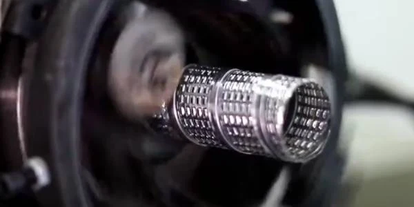 Spiral perforated mesh made by center tube rolling machine