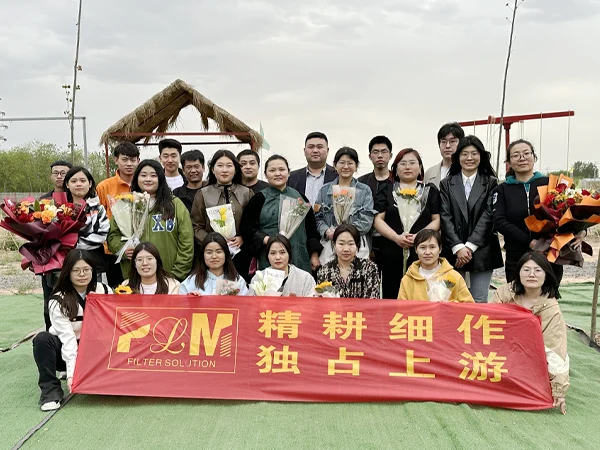 Our employees are taking a photo after a team building activity.