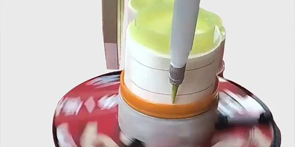 The filter paper gluing machine is applying glue to the filter paper.