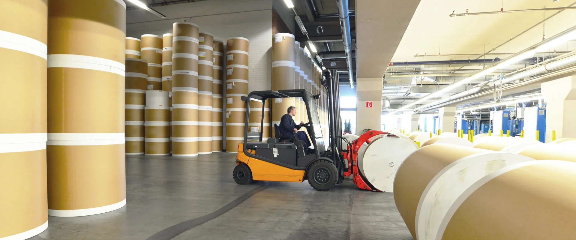 The worker is transporting filter papers.