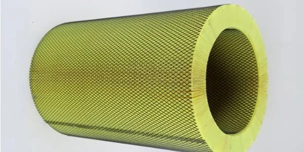 Truck air filter element with inner and outer mesh on a gray background