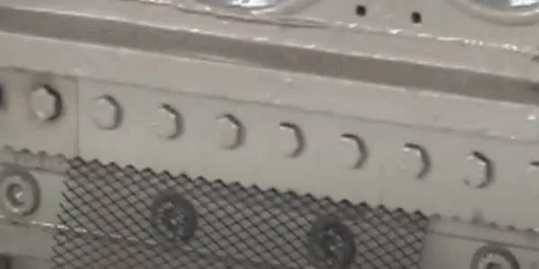 The steel plate mesh manufacturing machine is producing inner and outer mesh.