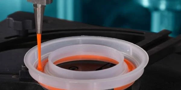 The glue injection machine is injecting glue into plastic mold.